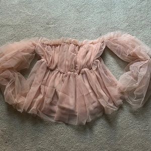 On twelfth top.  Pink and frilly- off shoulder